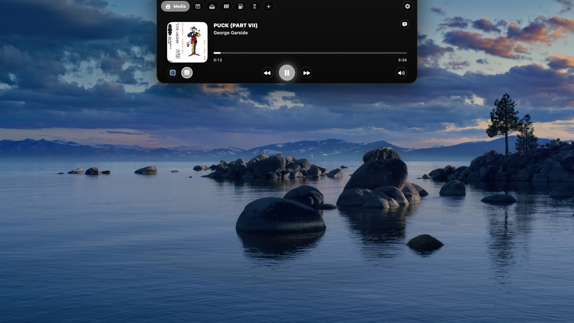 All in a notch expanded from the notch showing the Media tab — album art, track, scrubber and playback controls